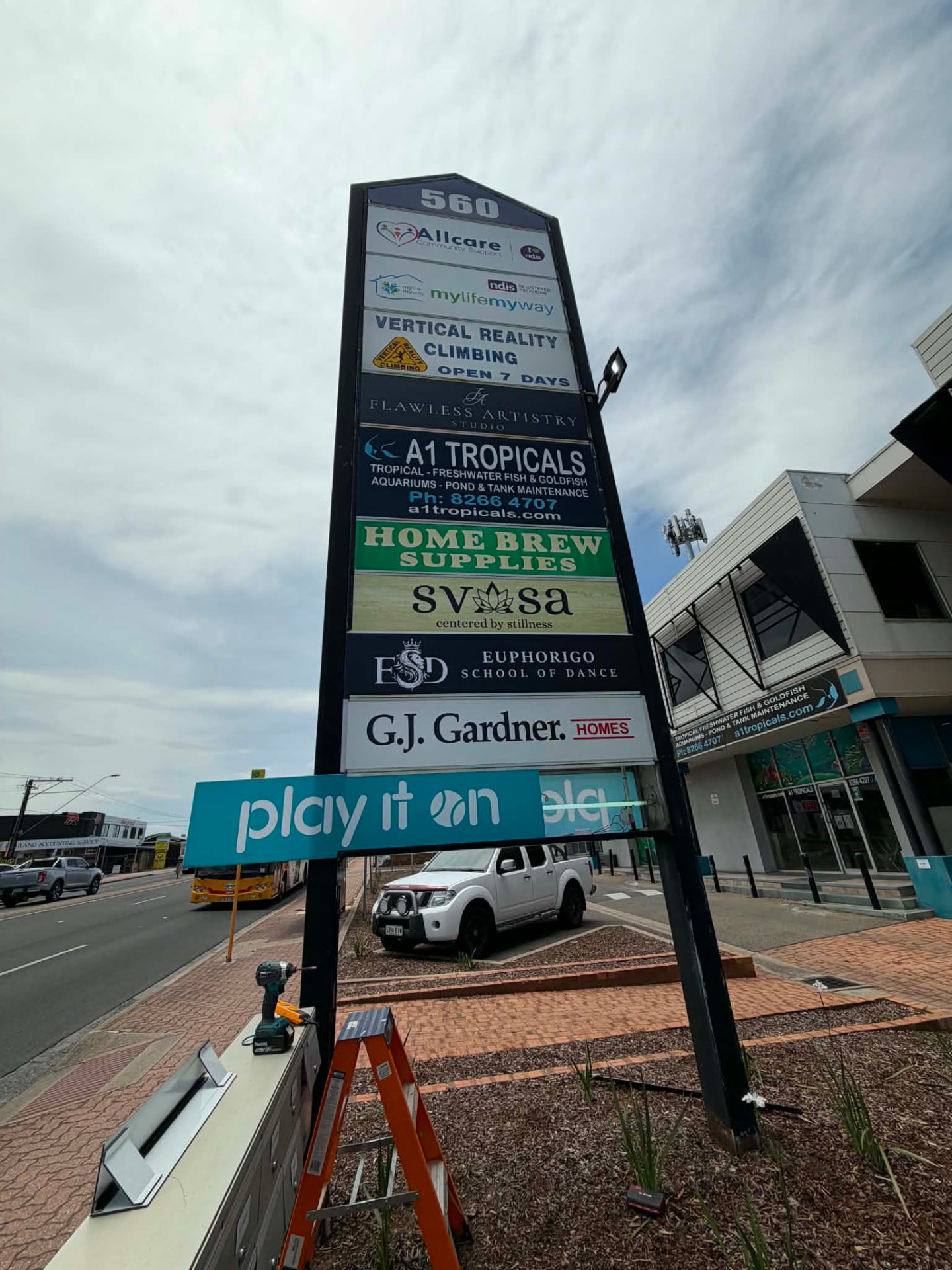Multi-tenant pylon sign with new illuminated sign panel installed